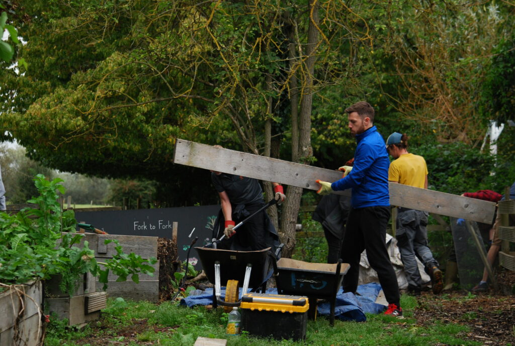 Centrica’s Responsible Business: Photo of a man outside holding a large plank of wood