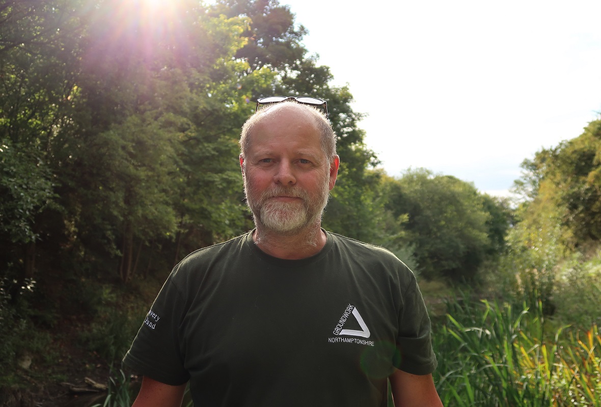 Photo of a man in a nature setting wearing a groundwork t-shirt
