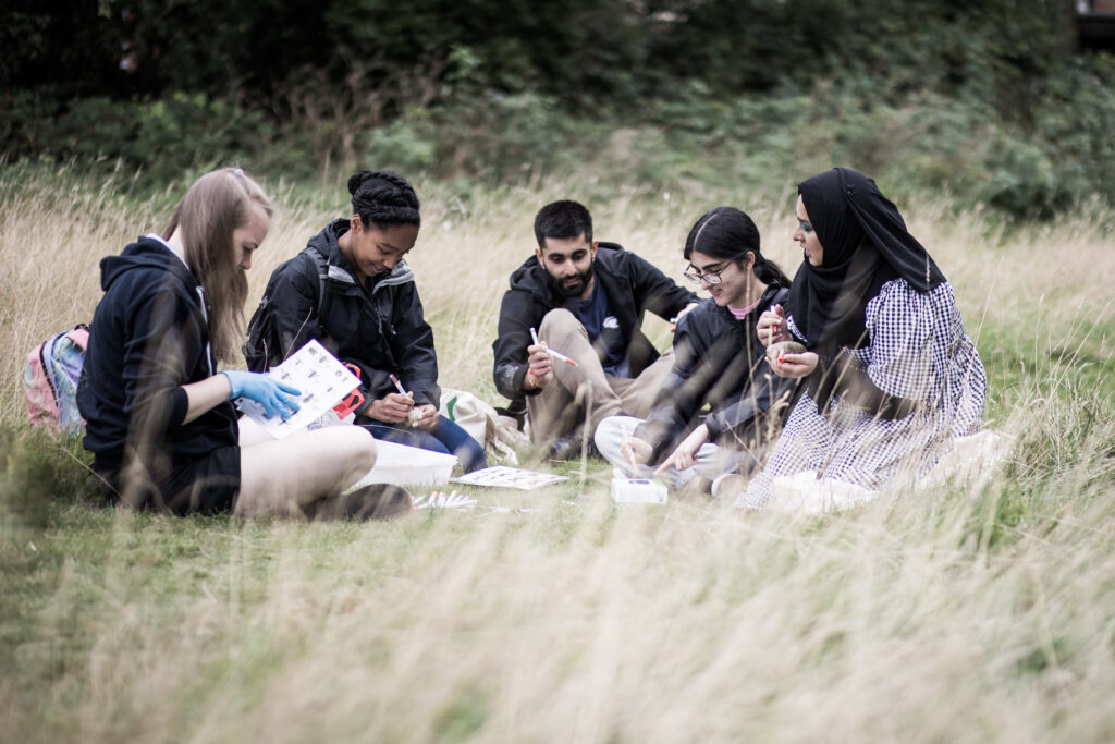 Young people enjoying the benefits green spaces for all can bring
